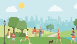 People at a park in front of a city. 