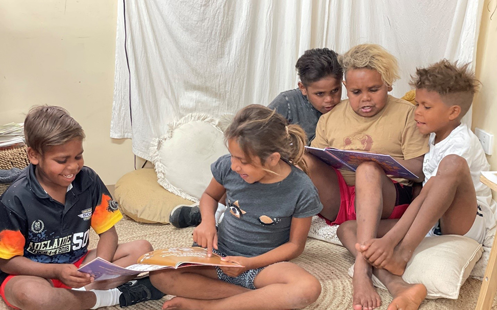 Hector, Marika, Gabriel, Malcolm, Michael at the Yalata Anangu School. Hector (Year 3): &ldquo;I like the book because the dogs do cheeky stuff, same as the dogs in Yalata.&rdquo; Michael (Year 4): &ldquo;It&rsquo;s funny and I like reading Pitjantjatjara words."