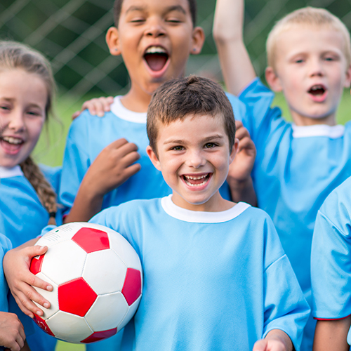 Children playing soccer