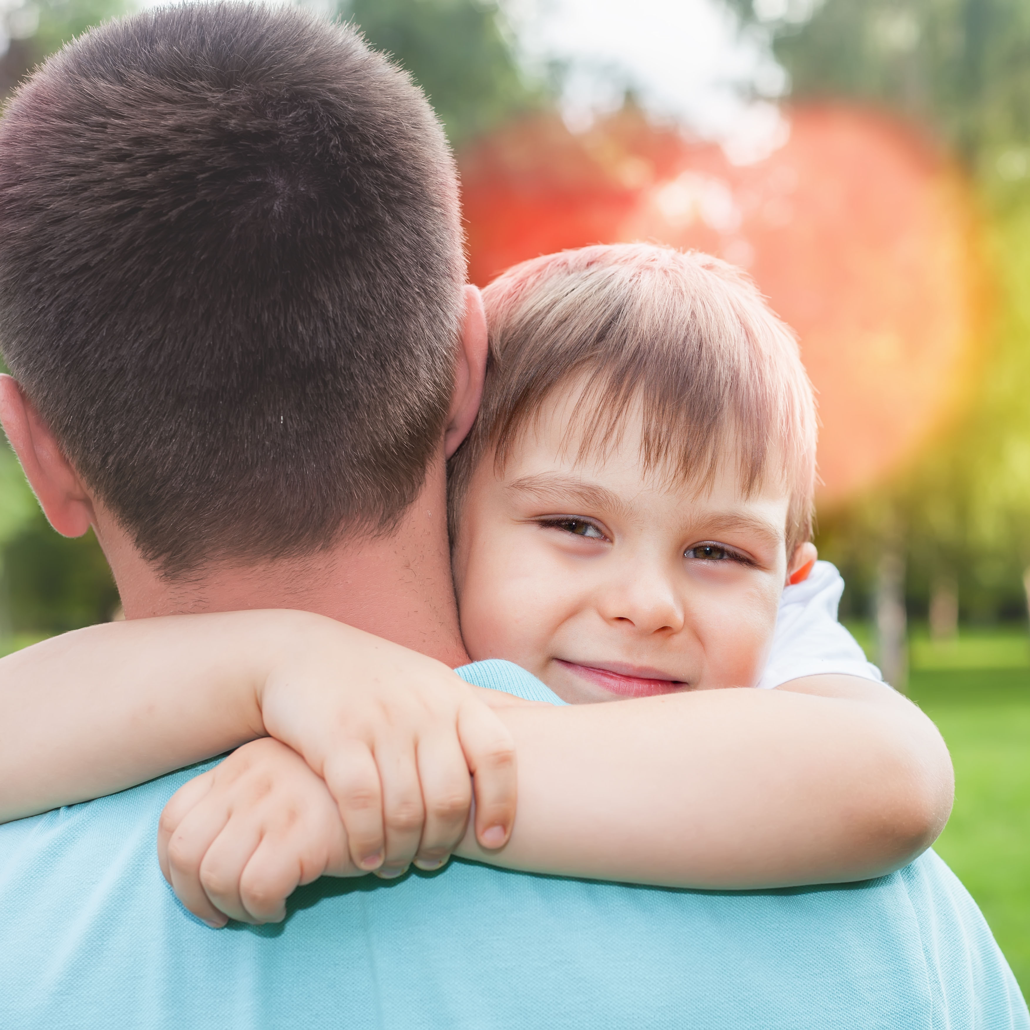 dad hugging boy shutterstock_445285360_web.jpg