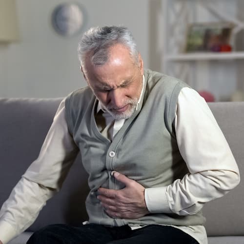 Man doubled over in pain