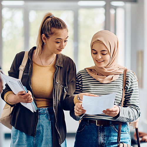 two uni students discussing work