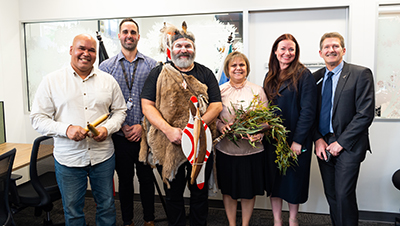 (L-R) Business Project Officer Errol Clarke, Aboriginal Student Engagement Officer Dylan Hunter, Senior Kaurna Man Mickey Kumatpi O&rsquo;Brien, Manager: Wirringka Student Services Leata Clarke, Division Executive Officer: Health Sciences Emily Adcock and Pro Vice Chancellor: Health Sciences Professor Roger Eston at City East.