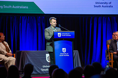UniSA student Kane O&rsquo;Brien (pictured at the lectern) was one of three students to share their research at the award ceremony.
