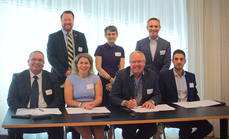 Representatives from Defence Science and Technology Group, the University of South Australia and the Alan Turing Institute sign a Memorandum of Understanding to further research and development in AI and data science.