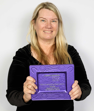 Professor Marion Eckert receiving the HESTA Australian Nursing and Midwifery Outstanding Organisation Award on behalf of the RBRC.